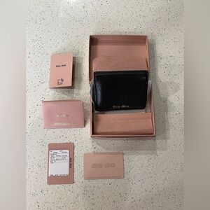 Miu Miu Men’s Black Leather Madras Bifold Wallet